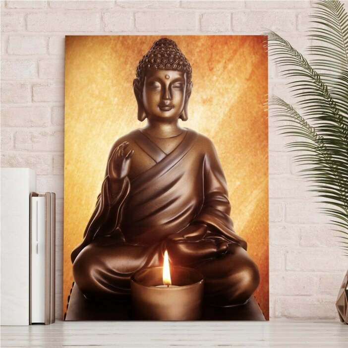 Tableau Bouddha assis devant une bougie