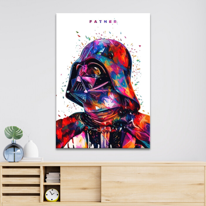 Tableau Dark Vador multicolore fond blanc accroché sur un mur au-dessus d'un buffet en bois clair avec un réveil et un vase.